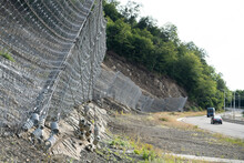 Active Robust Rockfall Barrier System With Wire Mesh Along The Road, Brake For Rocks Fall. Slope Strengthening After Landslide In Tskneti Georgia. 