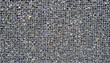 © Savvapanf Photo © - Gabion with heaps of small stones in a grid as the city or garden decoration, textured background