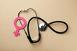 © New Africa - Female gender sign and stethoscope on beige background, flat lay. Women's health concept