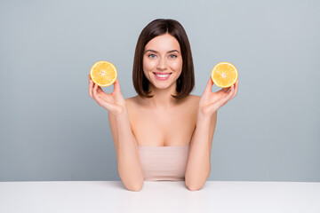 Sticker - Photo of beautician lady sit white table hold citrus ripe aesthetic pure hygiene treatment isolated over grey color background