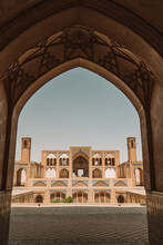Arched Passage Against Ancient Mosque