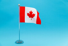 Canadian Table Flag Waving On Blue Background