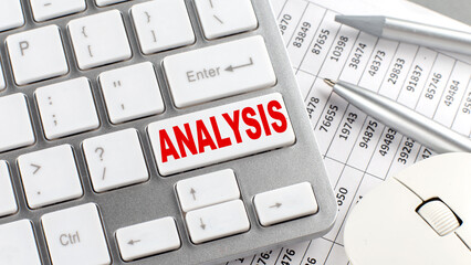 Poster - ANALYSIS text on a keyboard wirh chart and pencil