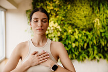 Young White Woman Doing Breathing Practice During Meditation