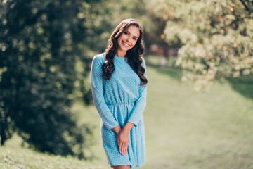 Canvas Print - Photo of charming carefree young lady wear blue casual dress waking enjoying good weather outside countryside