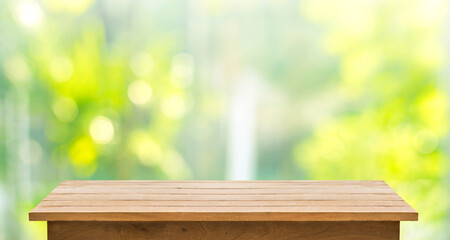 Wall Mural - Selective focus.Empty wood table top on beautiful background of blur garden in the morning.