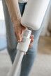 © brizmaker - Person changing new nozzle in vacuum cleaner