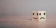 © The KonG - Emotional state and Mental health concept. Happy smile positive feeling face bright side and sad feeling negative face icon on wood cube block for choice mindset. With copy space for text.