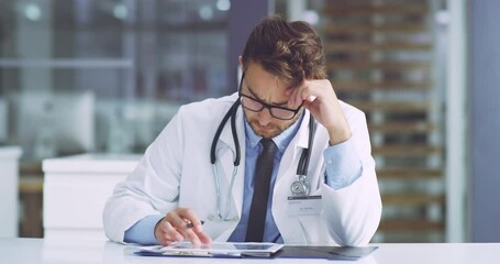 Wall Mural - Serious, concerned and confused medical healthcare doctor revising a patients records on a tablet. A professional surgeon is unsure about a report going through test results of a client.