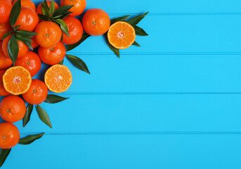 Wall Mural - tangerines with green leaves