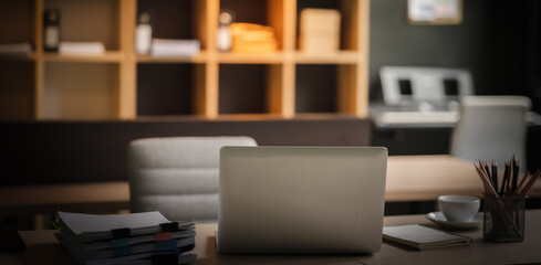 Poster - closeup Office business workplace with laptop on desk computer background document on table copy space workspace creative design books, modern interior .