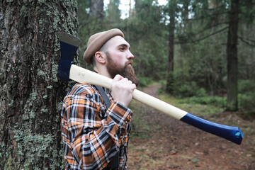 Wall Mural - A bearded lumberjack with a large ax