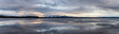 View of a frozen Yellowstone Lake with snow covered mountains in American Landscape. Yellowstone National Park. United States. Nature Background Panorama