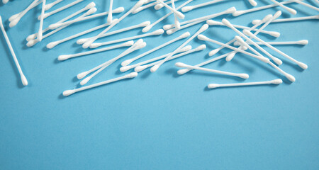 Wall Mural - Cotton buds or swabs for ear cleaning on the blue background.