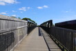 © Anthony - A metal bridge running over the bird sanctuary on the River Exe near Topsham in Devon, England