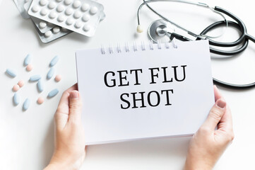 Wall Mural - Get Your Flu Shot card in hands of Medical Doctor