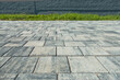 paving slabs, in the photo sidewalk decorative gray tiles close-up