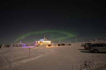 Sticker - Northern lights over rural house in the field covered in snow