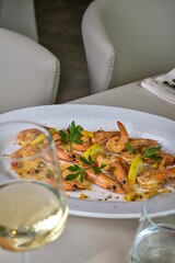 Sticker - Plate of shrimp with lemons and white wine