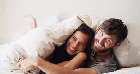 Canvas Print - Fun, romance and happy couple embracing in bed at home, bonding and being affectionate. Boyfriend and girlfriend cuddling under a blanket, enjoying their relationship and intimate, romantic moments