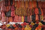 Fototapeta  - Bunches of different delicious churchkhelas at market