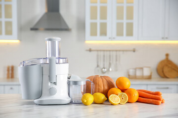 Poster - Modern juicer, fresh vegetables and fruits on table in kitchen