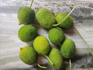 Sticker - Spiny gourd fruits on the marble table