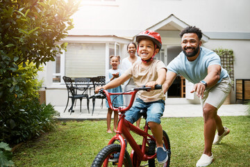 Sticker - Learning, bicycle and proud dad teaching his young son to ride while wearing a helmet for safety in their family home garden. Active father helping and supporting his child while cycling outside