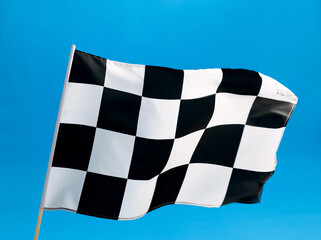 Checkered flag waving on blue background