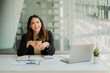 © ArLawKa - Asian businesswoman or accountant using laptop while analyzing financial data with weekly schedule in the modern office