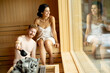 © BGStock72 - Young couple relaxing in the sauna