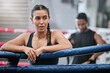 Fit, active and tired boxer taking break, resting and breathing after workout, training and exercise with boxing coach in ring. Sporty, athletic or strong woman after kickboxing fight or sports match