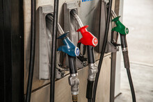 Three Fuel Dispenser Nozzles At Petrol Pump