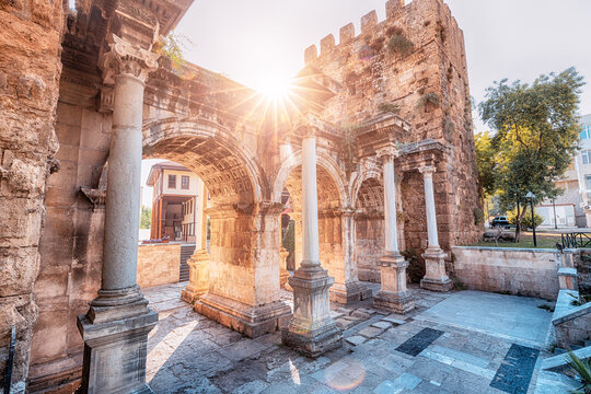 famous gate or hadrian arch in antalya without visitors with sunflare. travel landmarks and must-see