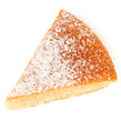 Wedge of lemon sponge cake with icing sugar topping isolated on white from above.