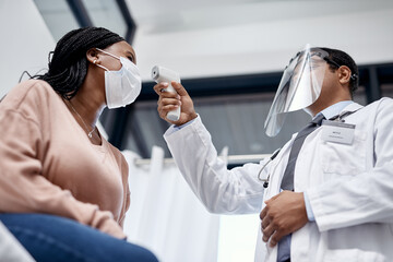 Aufkleber - Covid screening with a doctor measuring temperature of a patient using an infrared thermometer during an appointment or checkup. Female getting tested for corona virus and wearing a mask from below
