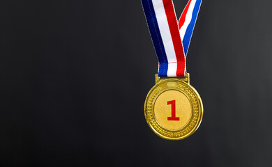 Gold medal on black background