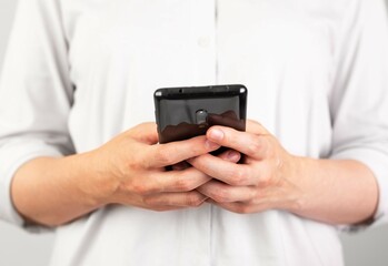 Poster - Woman hands texting message at phone. Female using Android for instant messaging, sharing photos, videos in messengers or typing SMS. Frontal view. High quality photo