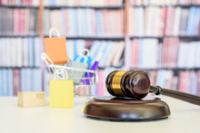 Consumer Protection Law, Rights And Guarantees, Financial Justice Concept : Judge Gavel, Bags In A Shopping Cart, Depicting A Safeguard Designed To Protect Consumers From Fraudulent Business Practices