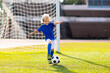 © famveldman - Kids play football. Child at soccer field.