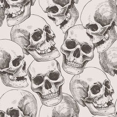 Wall Mural - Seamless pattern of hand drawn human skulls. Vector graphic beige illustration.