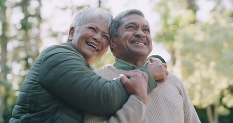 Poster - Carefree, happy and loving senior couple standing together while thinking and dreaming about a happy future and retirement. Old mature man and woman feeling free while enjoying fresh air in a park