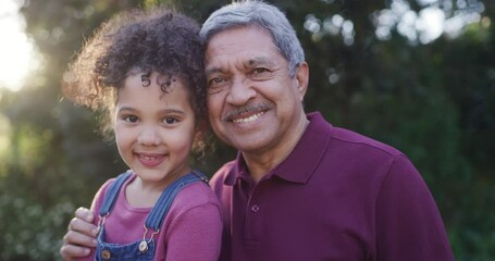 Canvas Print - Faces of a grandfather and granddaughter smiling, bonding and hugging together in nature outside. Portrait of a little girl embracing, looking happy and spending quality time with her grandpa at park