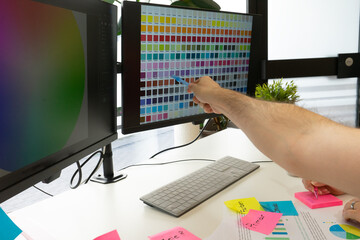 Business man make color selection for logo design