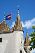 turret of castle of Nyon and flag of canton of Vaud in Switzerland