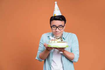 Sticker - Young Asian man holding birthday cake