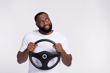 Wall Mural - Photo of upset suspicious man wear casual t-shirt riding automobile looking empty space isolated white color background