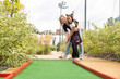 © Angelov - little girl and mother playing mini golf