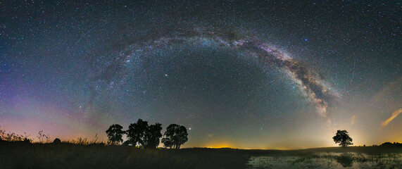 Wall Mural - Panorama view of milky way in the night sky, deep starry sky with Milky way over head