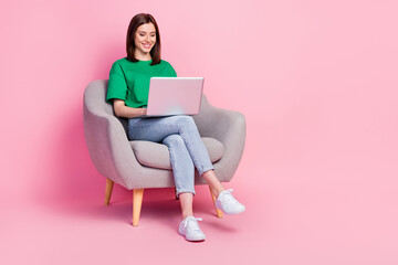 Sticker - Full length portrait of cheerful pretty person sit chair use wireless netbook isolated on pink color background